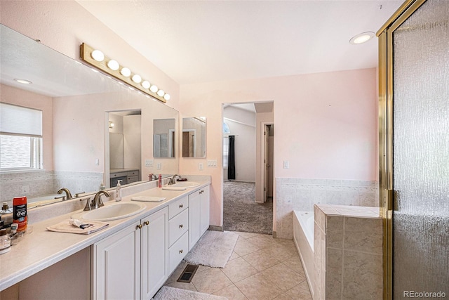 17045 Hastings Ave, Parker, CO 80134 - full bath featuring tile patterned floors, double vanity, and a bath