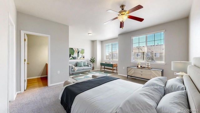 16047 E Geddes Ln Unit 128, Aurora, CO 80016 - bedroom featuring carpet flooring, baseboards, and ceiling fan