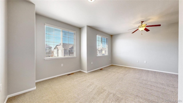16047 E Geddes Ln Unit 128, Aurora, CO 80016 - unfurnished room with carpet floors, a ceiling fan, and baseboards