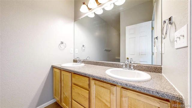 16047 E Geddes Ln Unit 128, Aurora, CO 80016 - bathroom with double vanity and a textured wall