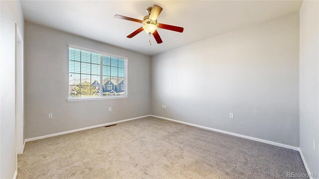 16047 E Geddes Ln Unit 128, Aurora, CO 80016 - carpeted empty room with baseboards and ceiling fan