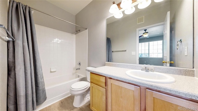 16047 E Geddes Ln Unit 128, Aurora, CO 80016 - full bath with toilet, a ceiling fan, shower / bath combo, vanity, and wood finished floors