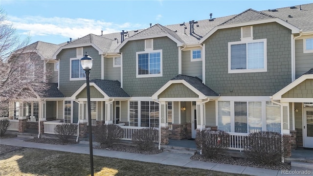 16047 E Geddes Ln Unit 128, Aurora, CO 80016 - view of front of house with covered porch and stone siding