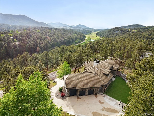 2548 Keystone Dr, Evergreen, CO 80439 - view of subject property with a forest and a mountain backdrop
