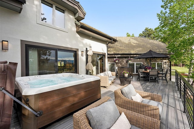 2548 Keystone Dr, Evergreen, CO 80439 - deck with a hot tub and outdoor dining space