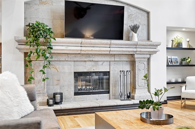 2548 Keystone Dr, Evergreen, CO 80439 - living room featuring wood finished floors and a tile fireplace