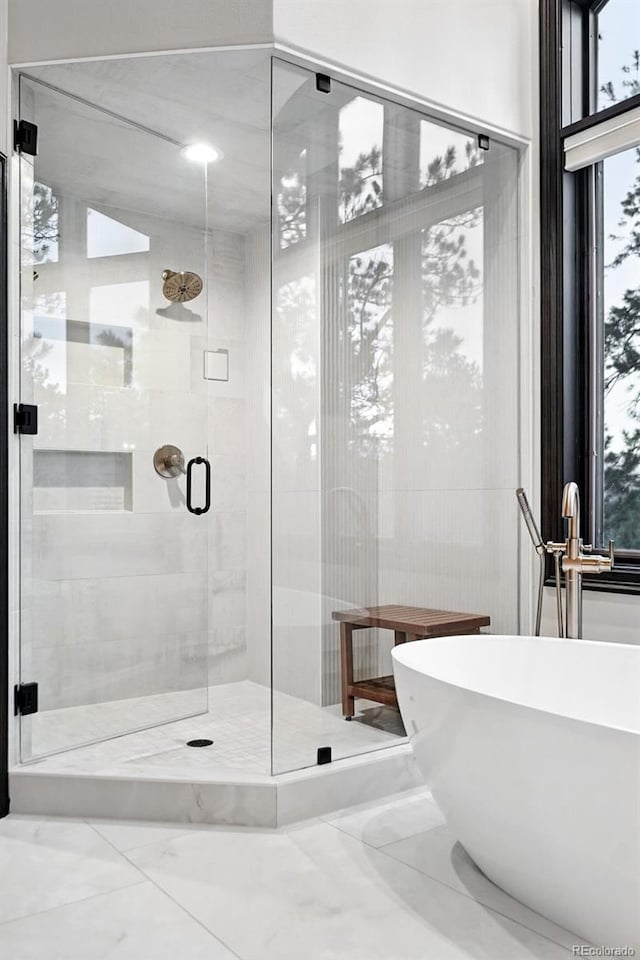 2548 Keystone Dr, Evergreen, CO 80439 - bathroom with a freestanding bath, a stall shower, and a sink