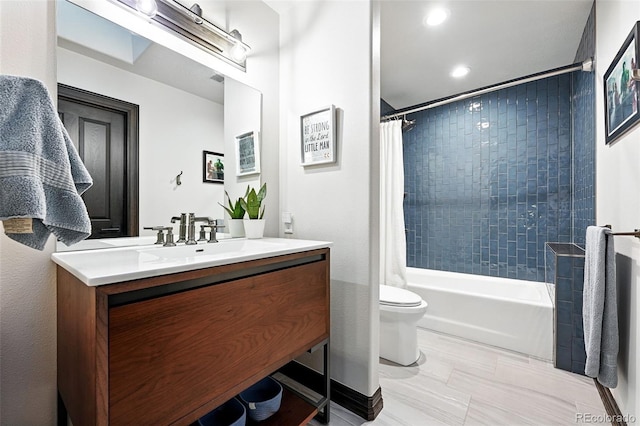 2548 Keystone Dr, Evergreen, CO 80439 - bathroom featuring vanity, toilet, shower / bath combo with shower curtain, and recessed lighting