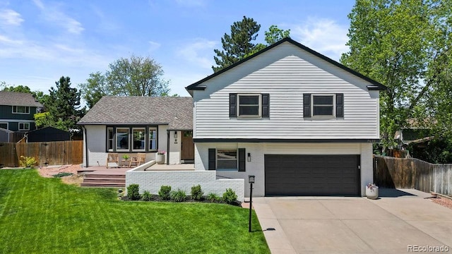 7633 S Gilpin Ct, Centennial, CO 80122 - split level home featuring a garage, a porch, concrete driveway, and brick siding