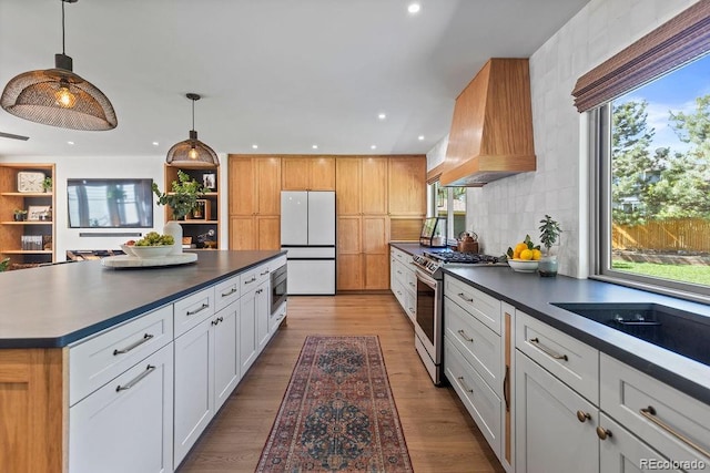 7633 S Gilpin Ct, Centennial, CO 80122 - kitchen featuring stainless steel appliances, dark countertops, custom range hood, open shelves, and recessed lighting