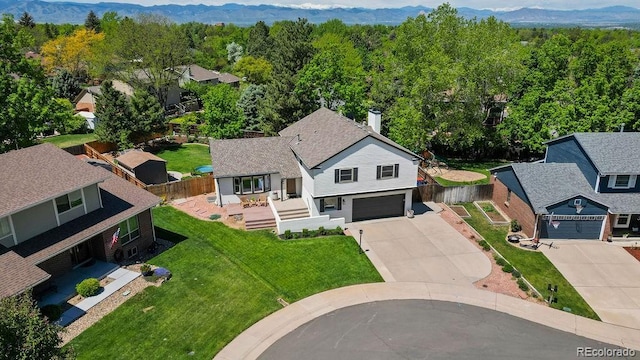 7633 S Gilpin Ct, Centennial, CO 80122 - view of subject property featuring a mountain backdrop and a heavily wooded area