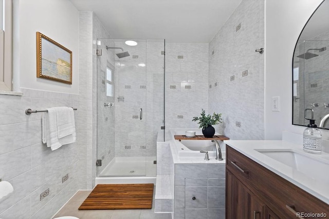 7633 S Gilpin Ct, Centennial, CO 80122 - full bath with vanity, a stall shower, a bath, tile walls, and tile patterned floors