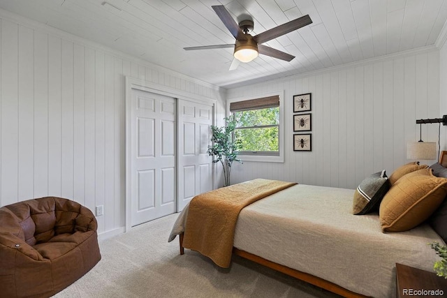7633 S Gilpin Ct, Centennial, CO 80122 - bedroom featuring carpet flooring, ornamental molding, a closet, wooden walls, and ceiling fan
