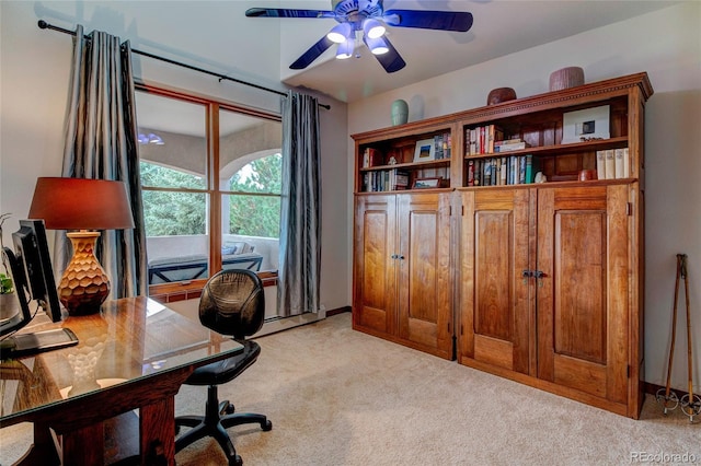 carpeted office with ceiling fan