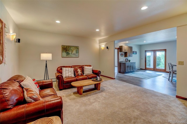 living room featuring sink and light wood-type flooring