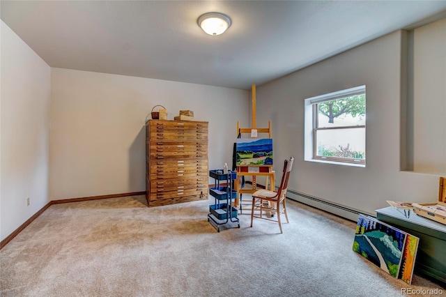 recreation room featuring light carpet and a baseboard heating unit