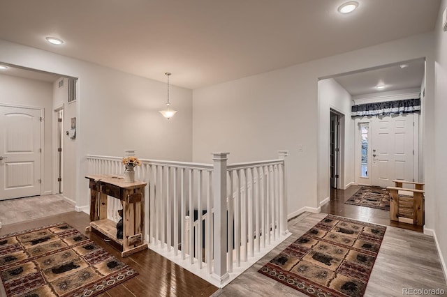 hall with dark hardwood / wood-style floors