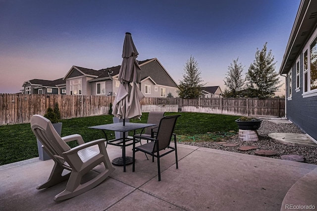 patio terrace at dusk with a yard