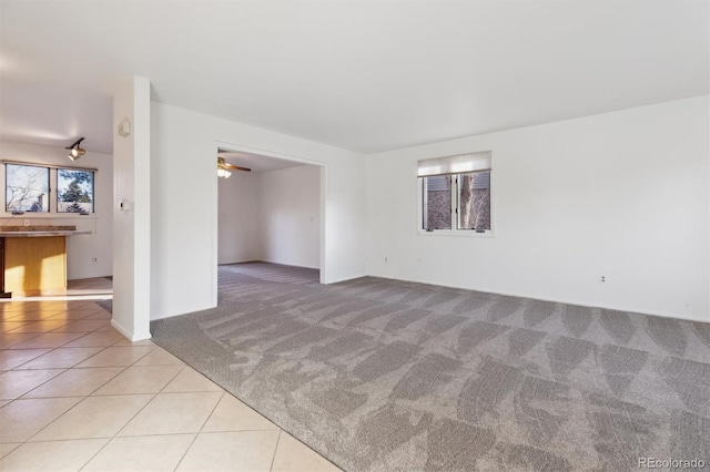 carpeted empty room with ceiling fan