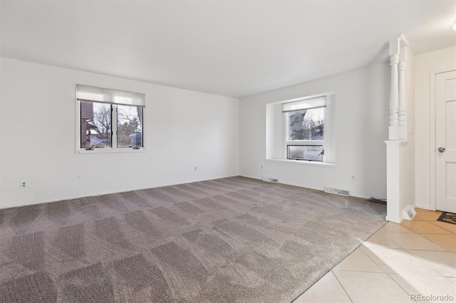 empty room with light colored carpet