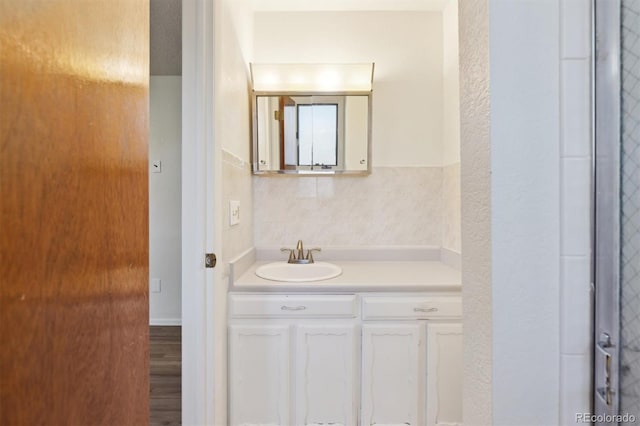 bathroom with vanity and hardwood / wood-style floors