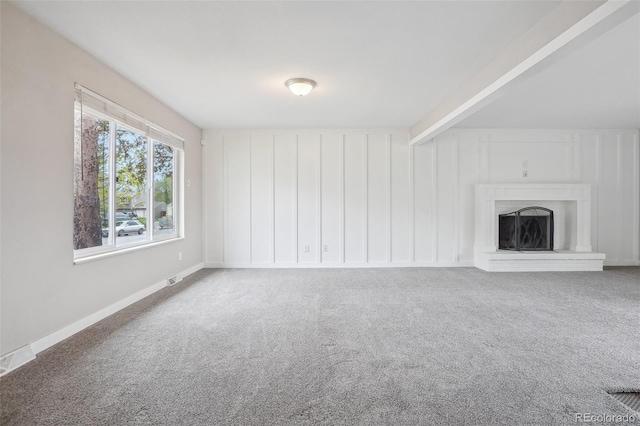 4623 S Kalispell Way, Aurora, CO 80015 - unfurnished living room with carpet floors, a fireplace with raised hearth, and baseboards
