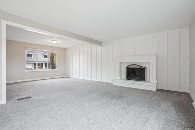 4623 S Kalispell Way, Aurora, CO 80015 - unfurnished living room with carpet floors and a fireplace with raised hearth