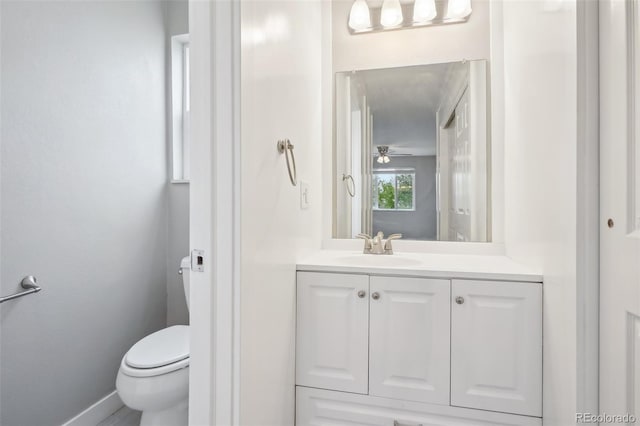 4623 S Kalispell Way, Aurora, CO 80015 - bathroom featuring toilet, vanity, and baseboards