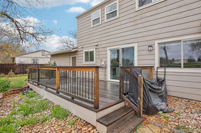 4623 S Kalispell Way, Aurora, CO 80015 - wooden terrace with a fenced backyard