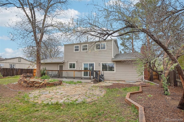 4623 S Kalispell Way, Aurora, CO 80015 - back of house featuring a deck, a shingled roof, and a patio area