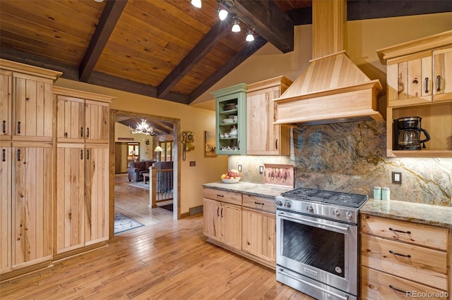 89 Aspen Leaf Ln, Bellvue, CO 80512 - kitchen with high end stainless steel range, light brown cabinetry, premium range hood, light wood-style flooring, and light stone counters