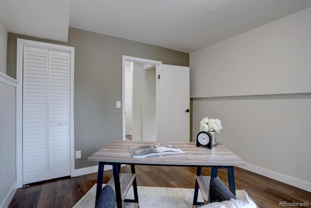 office area with baseboards and wood finished floors