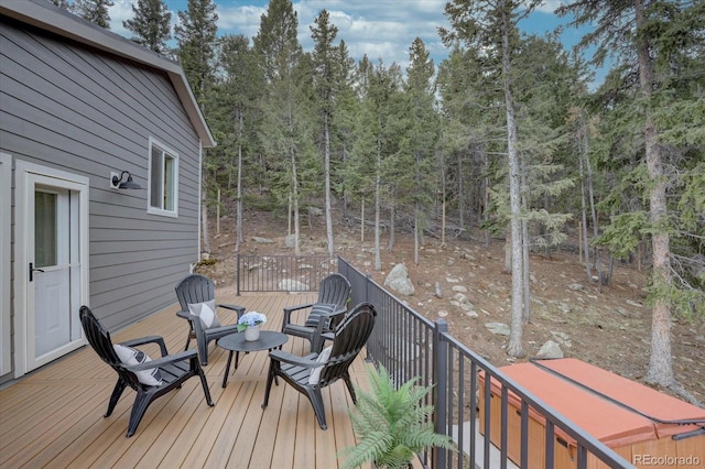 deck featuring a view of trees