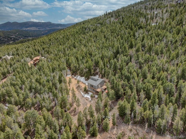 aerial view with a mountain view and a view of trees