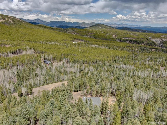 mountain view with a wooded view