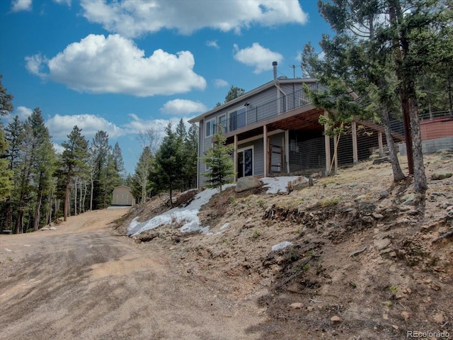 back of property with a wooden deck