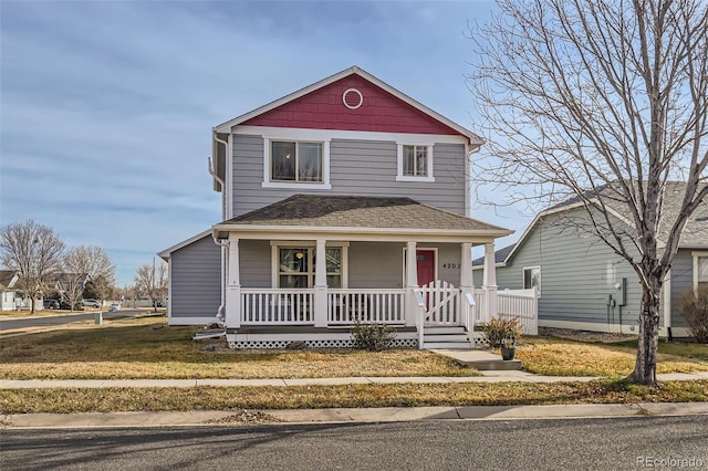 front of property featuring covered porch and a front yard