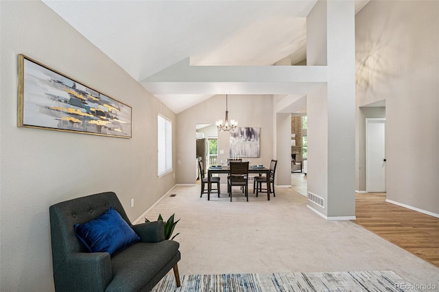 6713 W 98th Cir, Westminster, CO 80021 - dining area with a chandelier, healthy amount of natural light, carpet floors, and vaulted ceiling