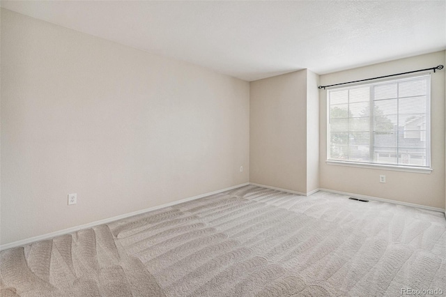 6713 W 98th Cir, Westminster, CO 80021 - unfurnished room with light colored carpet and baseboards