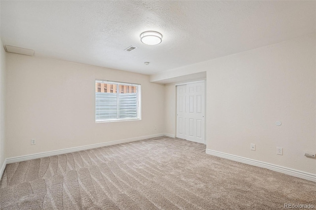 6713 W 98th Cir, Westminster, CO 80021 - unfurnished room featuring carpet floors and a textured ceiling