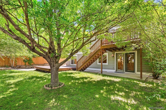 6713 W 98th Cir, Westminster, CO 80021 - view of yard featuring stairs, a deck, and a patio