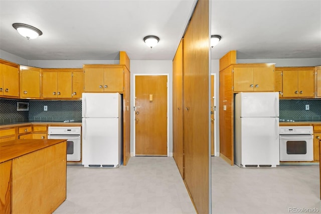 kitchen featuring light floors, white appliances, brown cabinets, and decorative backsplash