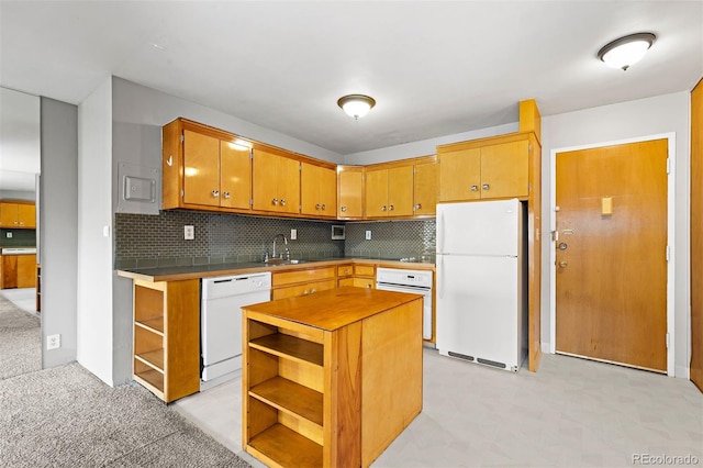 kitchen featuring white appliances, a kitchen island, a sink, open shelves, and backsplash