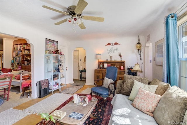 232 N 14th St, Colorado Springs, CO 80904 - living room with arched walkways, a ceiling fan, and light wood-style floors