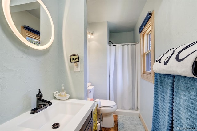232 N 14th St, Colorado Springs, CO 80904 - full bath featuring a shower with curtain, toilet, vanity, and baseboards