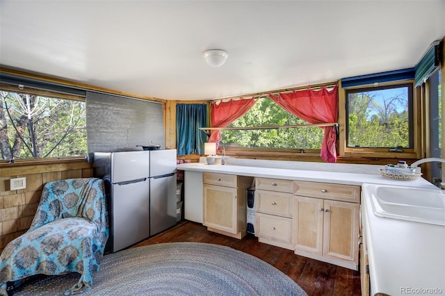 232 N 14th St, Colorado Springs, CO 80904 - kitchen with dark wood-type flooring, healthy amount of natural light, light countertops, a sink, and wooden walls