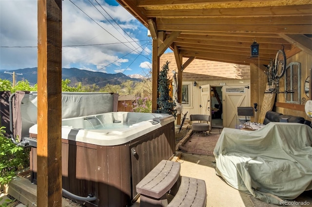 232 N 14th St, Colorado Springs, CO 80904 - view of patio / terrace with a hot tub and a mountain view