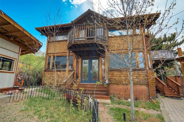 232 N 14th St, Colorado Springs, CO 80904 - cabin featuring stairs, a balcony, french doors, fence, and entry steps