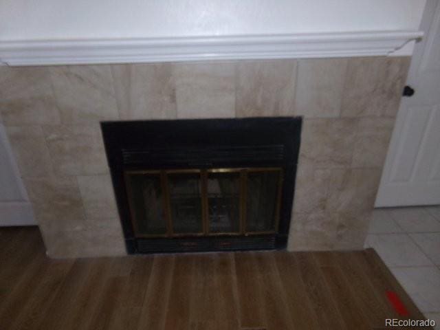 6705 S Field St Unit 802, Littleton, CO 80128 - detailed view of a tile fireplace and wood finished floors