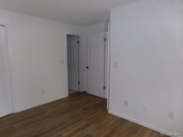 6705 S Field St Unit 802, Littleton, CO 80128 - empty room with wood finished floors and baseboards